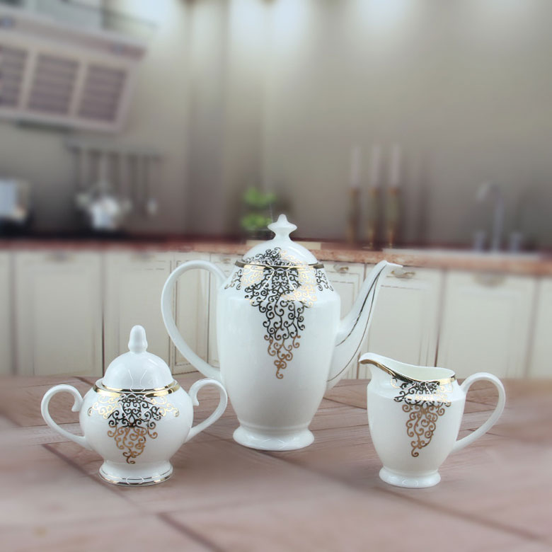 Bộ ấm trà sứ xương hoa văn vàng