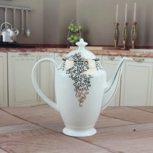Bộ ấm trà sứ xương hoa văn vàng